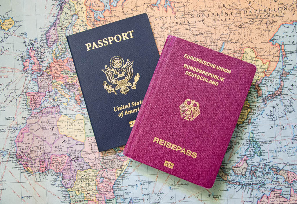 Our passports laying on a world map