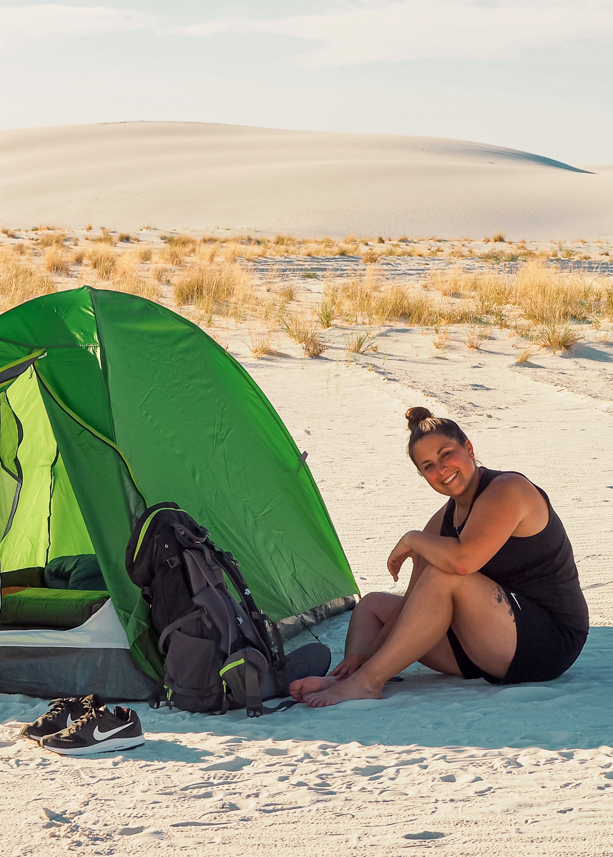 Rachel sitting next to our tent in the sand dunes