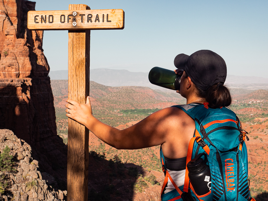 Rachel drinking water on the end of the trail