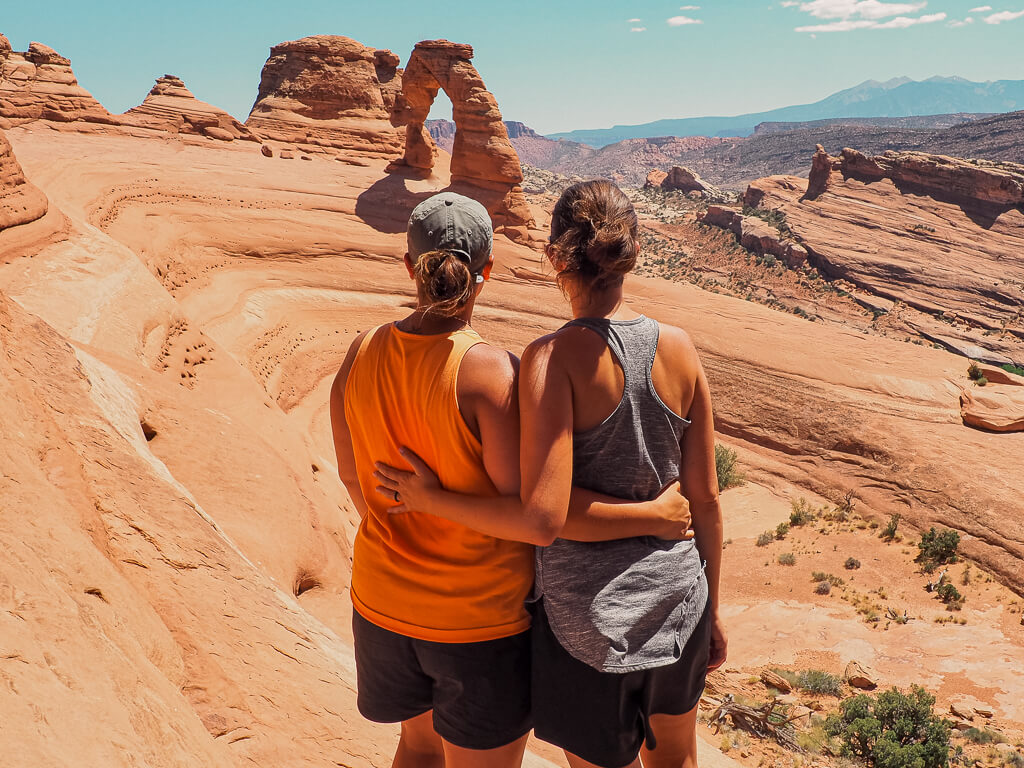 Us looking at Delicate Arch