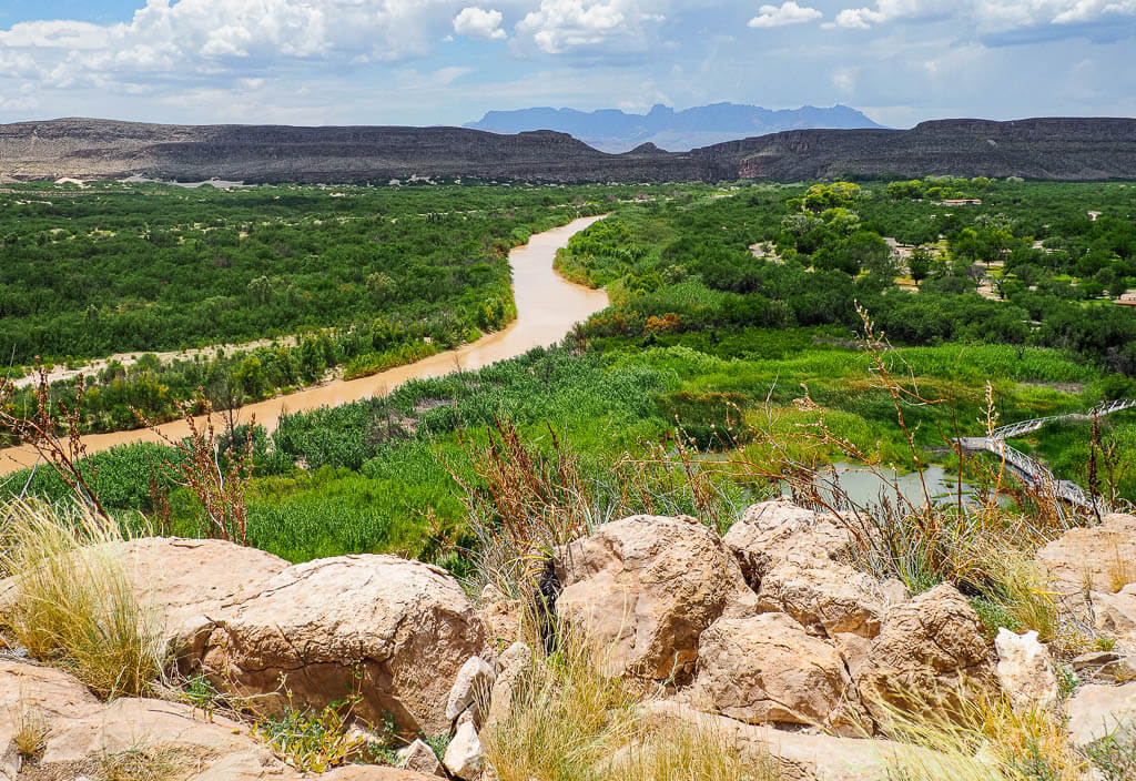 Stunning views of the mountain ranges, lush forests and the river from Emporium Peak