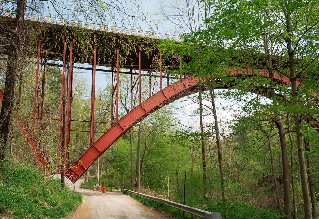 Walk underneath the red bridge to get to the Indian Brook Falls trailhead