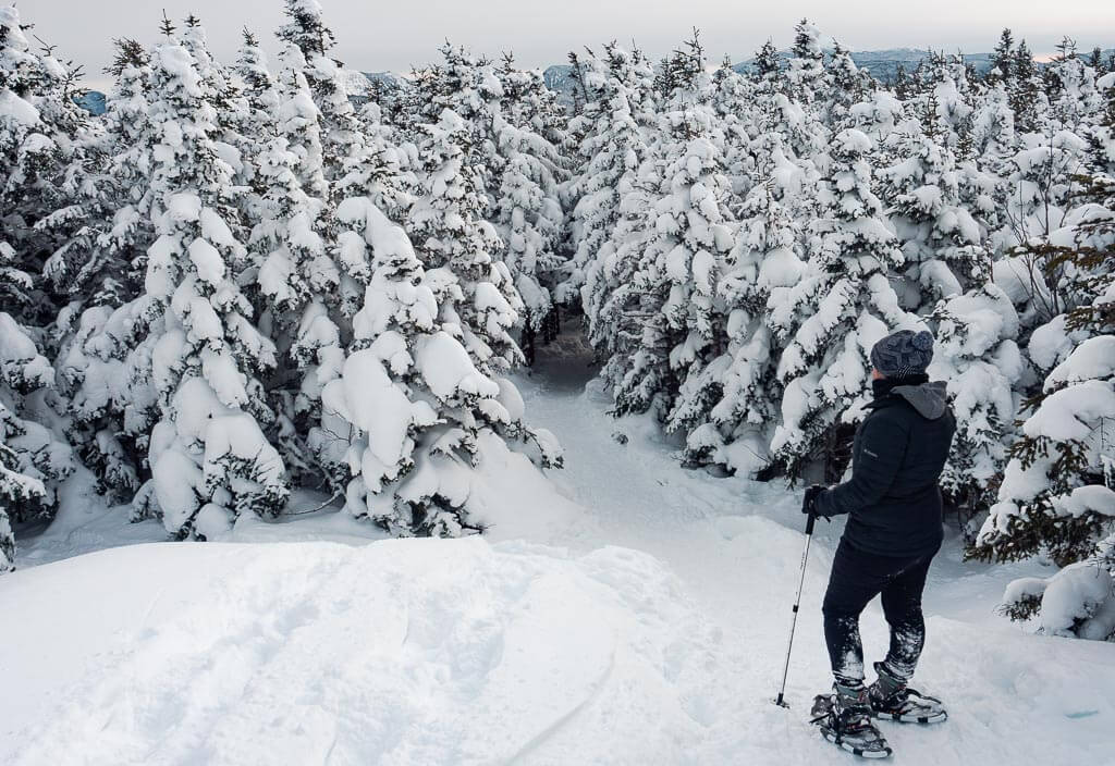 Rachel going down Cascade Mountain with her snowshoes