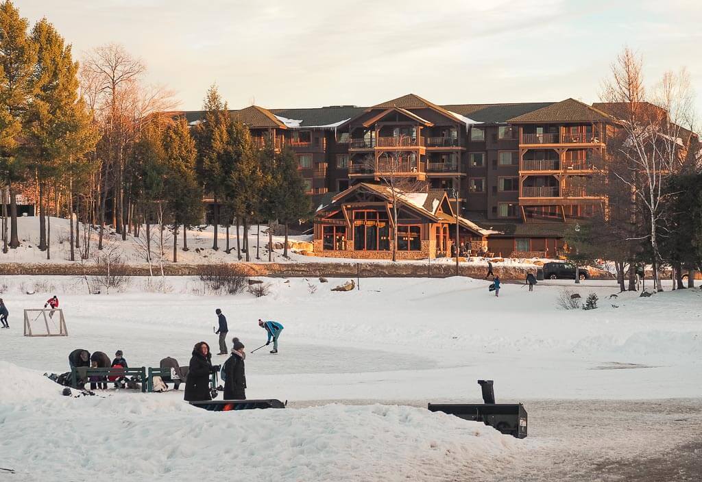 Children skating on ice during winter in Lake Placid