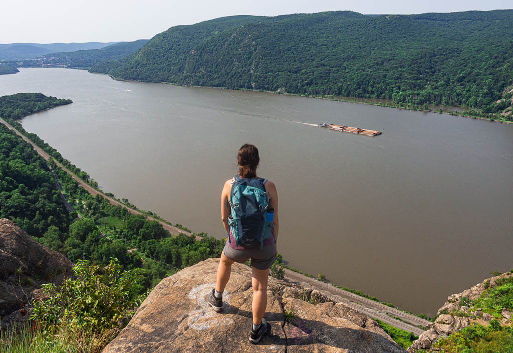 Dana overlooking the Hudson River while hiking Breakneck Ridge