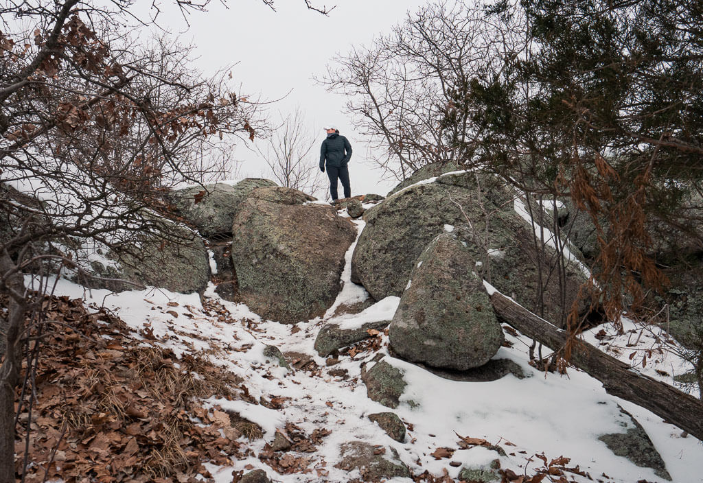 Rachel standing on a rock on the Reeves Brook Trail, one of the greatest hiking in Hudson Valley experiences