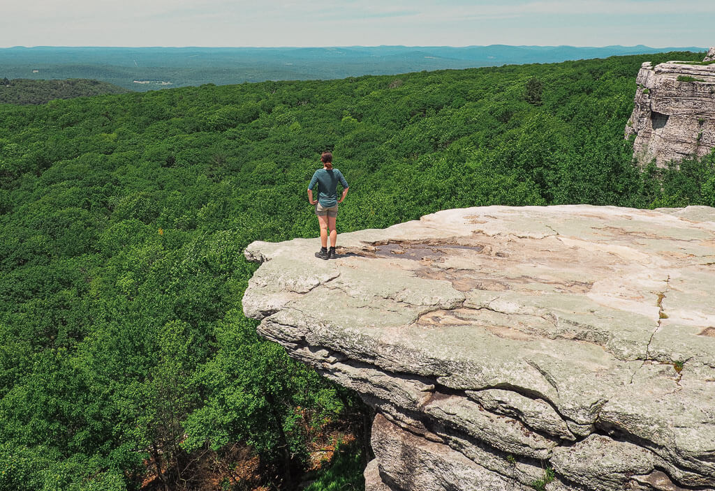 Dana standing at the edge of Sam's Point Overlook