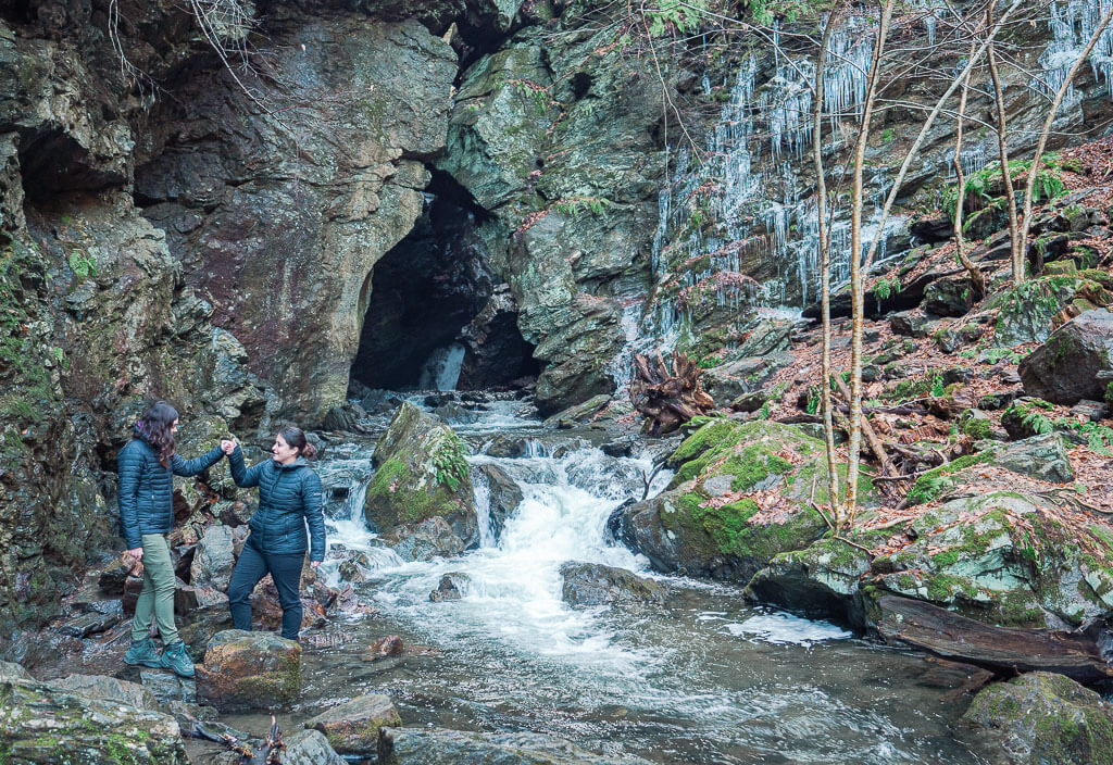 Us standing in front of the cave at the Dover Stone Church Trail