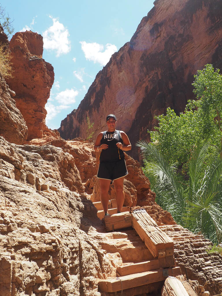 Rachel walking down the stairs to Beaver Falls Arizona