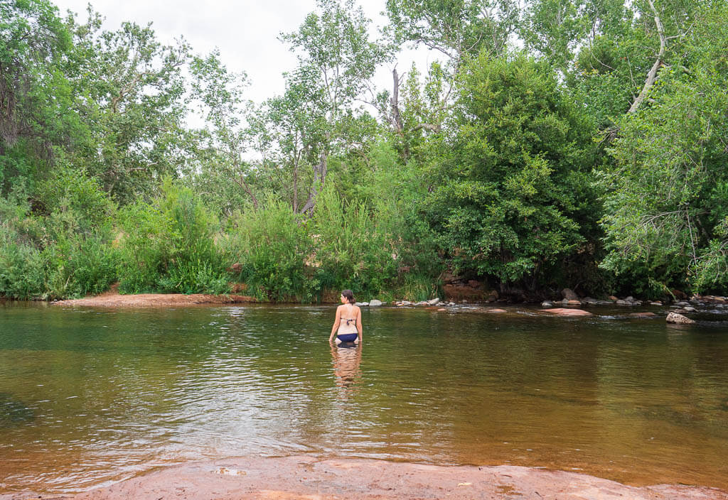 Dana wading in the water at Red Rock Crossing Sedona