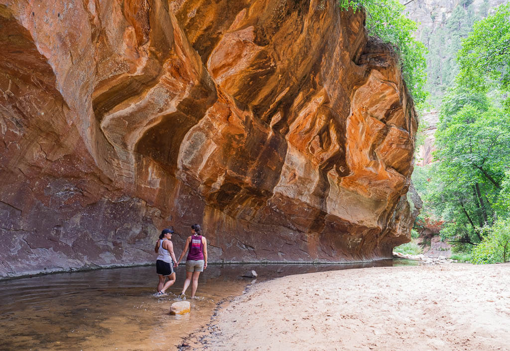 Us crossing the river on the West Fork trail while hiking Sedona