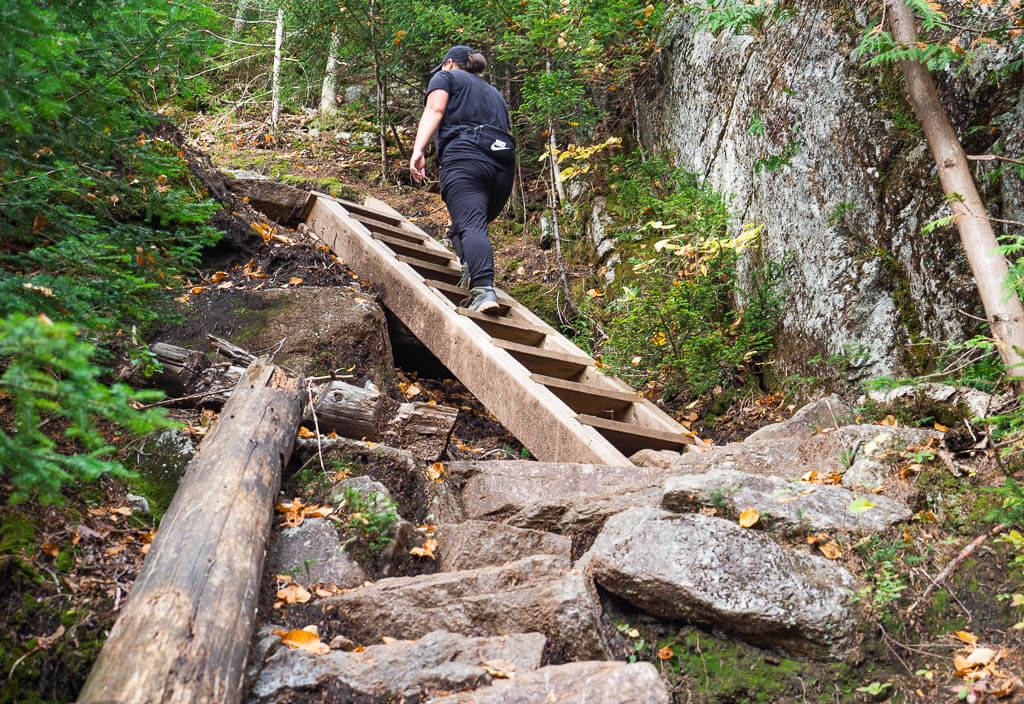 Rachel walking up ladder to the Indian Head Overlook