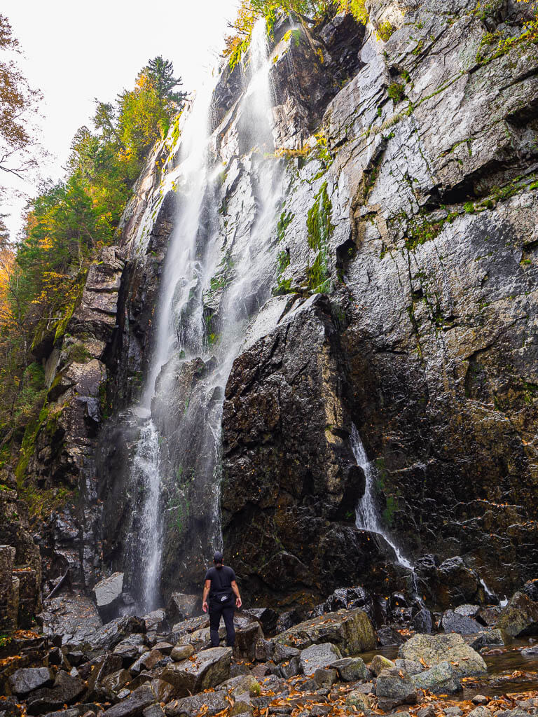 Rachel standing next to Rainbow Falls New York