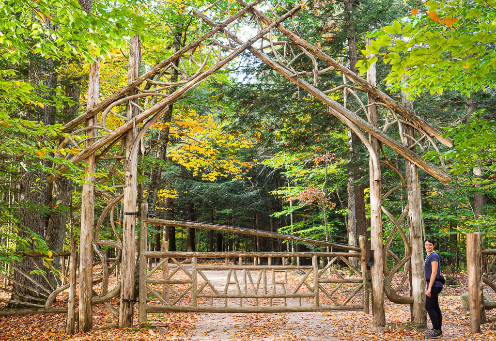 Dana tanding at the Adirondack Mountain Reserve hiking gate