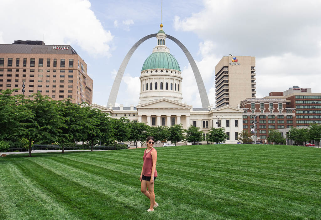 Dana walking in front of Gateway Arch