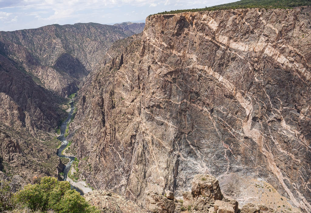 River running between high canyon walls