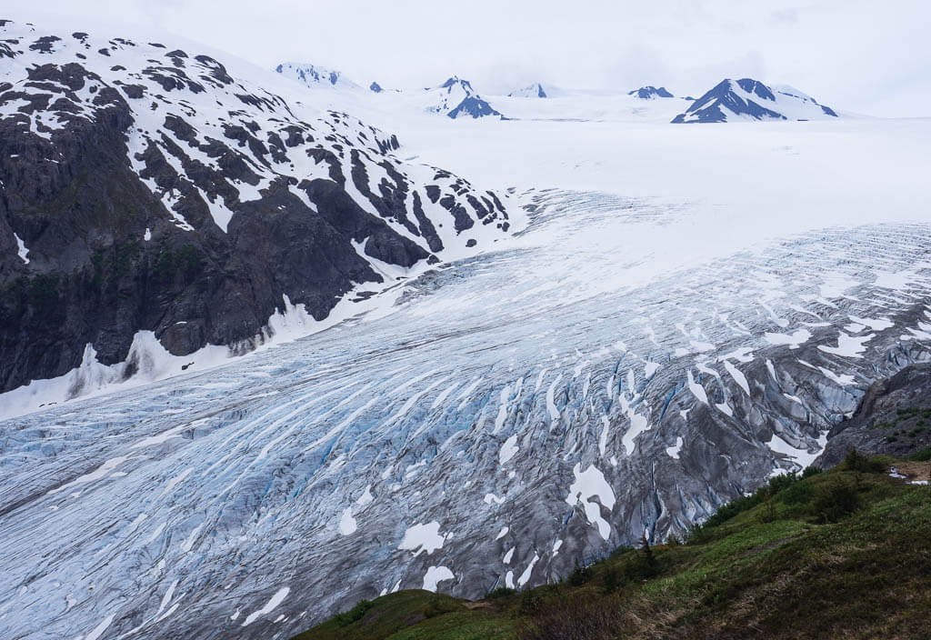 Hiking up next to the blue glacier in a west coast national park.