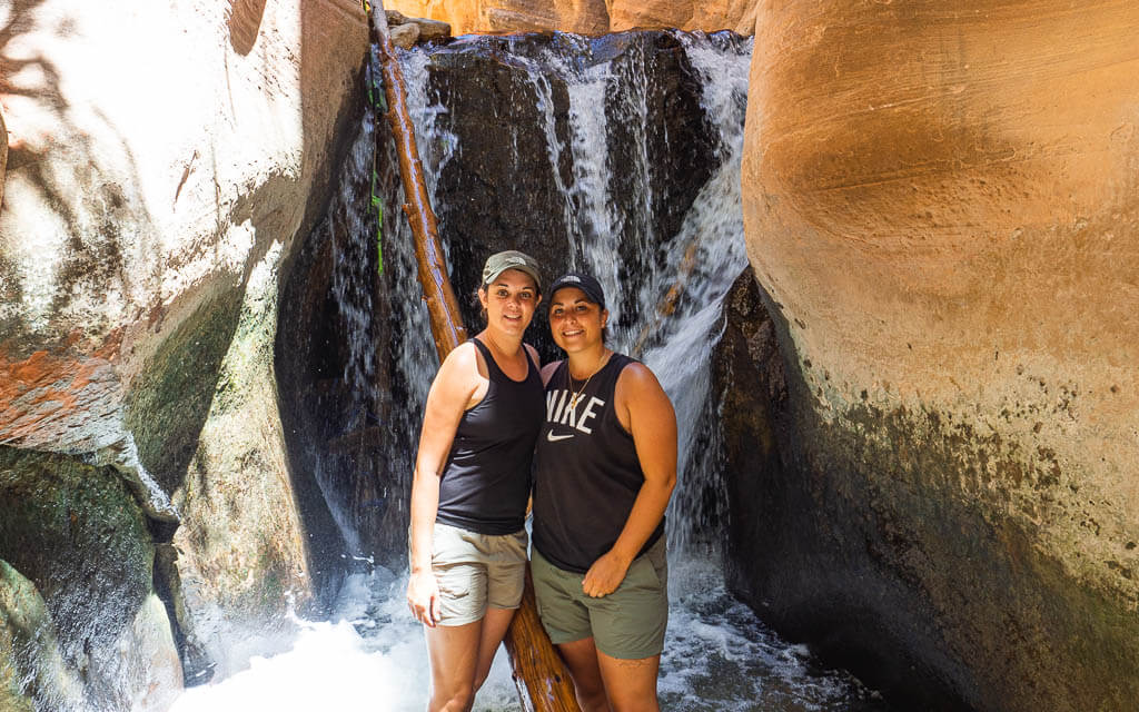 Us standing in front of the second Kanarra Falls waterfall