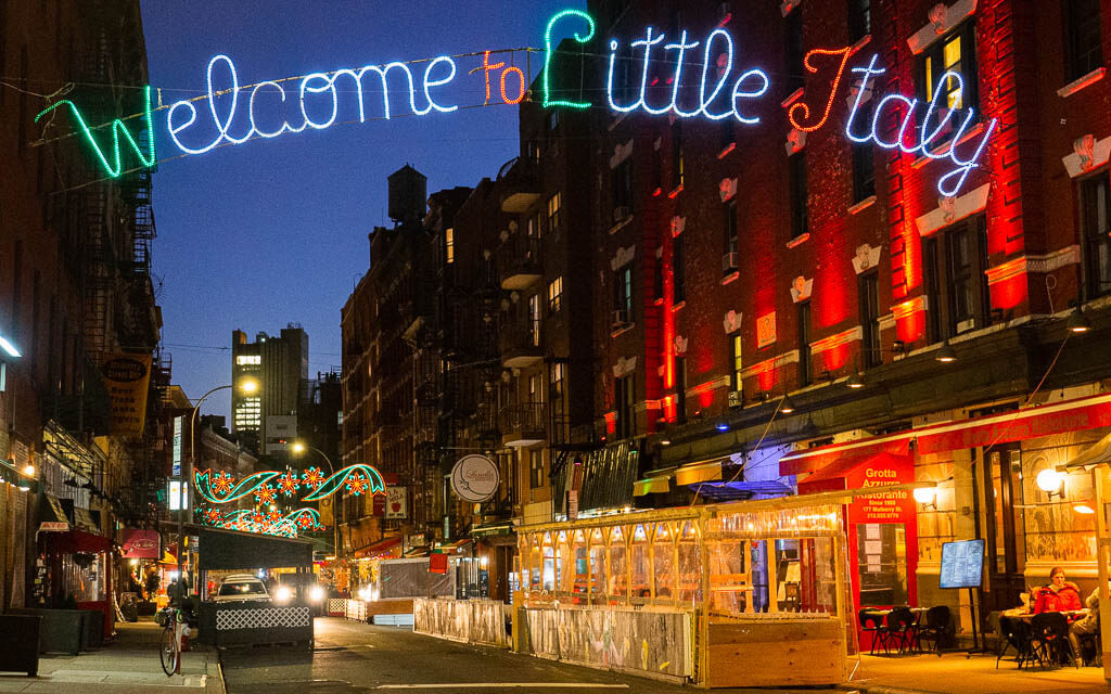 Little Italy Welcome Sign hanging over street