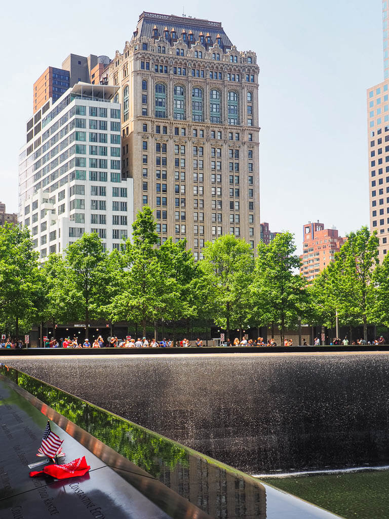 9/11 memorial spring in front of skyscrapers
