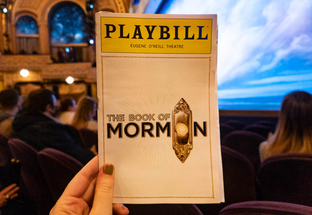 Book of Mormon Playbill in front of stage
