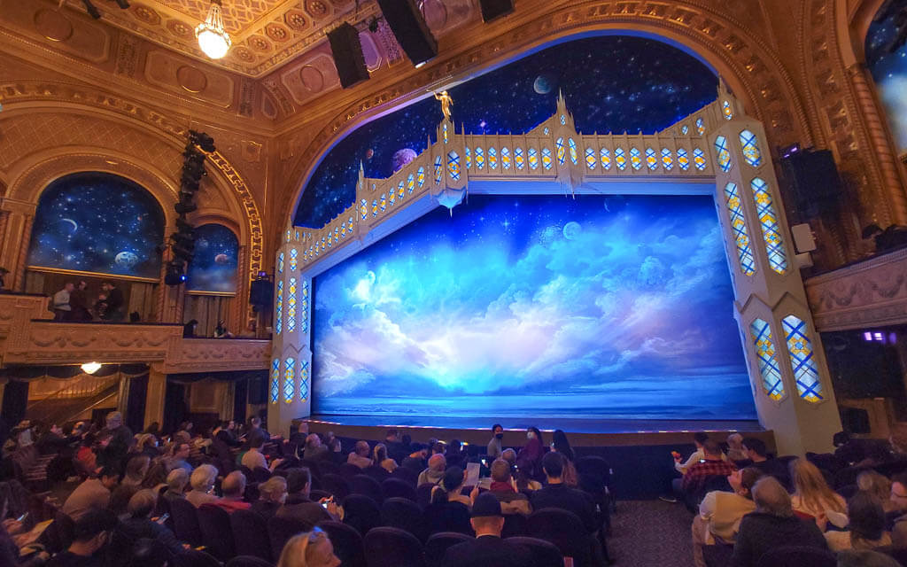 The Book of Mormon Stage and people following the Broadway dress code
